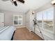 Bedroom featuring a telescope by the window, a ceiling fan, and plenty of natural light at 3397 Bluefish Dr, Hernando Beach, FL 34607