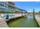 Waterfront property with a private dock, boat lift, and charming outdoor seating area at 3397 Bluefish Dr, Hernando Beach, FL 34607