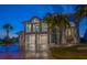 Stunning two-story coastal home boasts a three-car garage and a charming second-floor balcony at 3397 Bluefish Dr, Hernando Beach, FL 34607