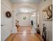 Inviting foyer with wood floors, decorative inlay, arched doorways, and column accents at 3397 Bluefish Dr, Hernando Beach, FL 34607