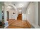 Bright foyer features decorative wood flooring, archways, and elegant columns, offering a grand entrance at 3397 Bluefish Dr, Hernando Beach, FL 34607