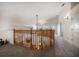Hallway features an open wooden railing overlooking the living room and hallway leading to other rooms at 3397 Bluefish Dr, Hernando Beach, FL 34607