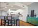Kitchen featuring white cabinets, stainless appliances, black countertops, and bar seating at 3397 Bluefish Dr, Hernando Beach, FL 34607