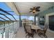 Covered lanai with seating and a view of the waterfront at 3397 Bluefish Dr, Hernando Beach, FL 34607