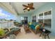 Screened-in lanai with cozy seating and water views at 3397 Bluefish Dr, Hernando Beach, FL 34607