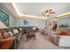 Comfortable living room featuring plush seating, ceiling fan, and a cozy atmosphere at 3397 Bluefish Dr, Hernando Beach, FL 34607