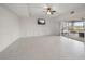 Bright and airy living area features tile flooring and sliding doors to a lanai at 3397 Bluefish Dr, Hernando Beach, FL 34607
