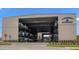 A large, beige marina building with rows of stacked boats, a visible sign, and clearly marked entrances at 3397 Bluefish Dr, Hernando Beach, FL 34607