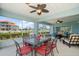 Stylish screened-in patio with dining and lounge area offers a relaxing space to enjoy serene water views at 3397 Bluefish Dr, Hernando Beach, FL 34607