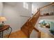 Bright foyer with hardwood staircase leading to an upstairs landing and an open living area with a view of the living room at 3397 Bluefish Dr, Hernando Beach, FL 34607