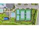 Aerial view of the community sports facilities, including tennis and basketball courts at 3541 Great Banyan Way, Wesley Chapel, FL 33543