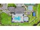Overhead shot of the community center with pools, lounge chairs, basketball and tennis courts at 3541 Great Banyan Way, Wesley Chapel, FL 33543