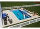 Aerial view of new construction community pool with spa, firepit and lounge at 3541 Great Banyan Way, Wesley Chapel, FL 33543