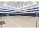 Bright and spacious indoor basketball court with polished wooden floors and high ceilings at 3541 Great Banyan Way, Wesley Chapel, FL 33543