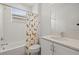 Bright bathroom featuring a shower-tub combination and white vanity, enhanced by natural light and clean design at 3541 Great Banyan Way, Wesley Chapel, FL 33543