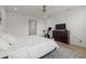 Bedroom with a television, workout bicycle, and an open view of the doorway at 3541 Great Banyan Way, Wesley Chapel, FL 33543