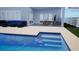 Patio area featuring outdoor seating and grill area just off the pool at 3541 Great Banyan Way, Wesley Chapel, FL 33543