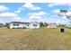 Backyard with a white picnic table and small shed at 3552 Middletown St, Port Charlotte, FL 33952