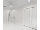 Bedroom with white ceiling and marble-patterned tile flooring and closet at 3552 Middletown St, Port Charlotte, FL 33952
