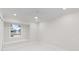 Bright bedroom with white walls and marble flooring, offering a serene and modern feel at 3552 Middletown St, Port Charlotte, FL 33952