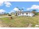 Charming single-story home featuring a covered entry, fresh white paint, and a bright, inviting atmosphere at 3552 Middletown St, Port Charlotte, FL 33952