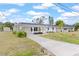 Charming single-story home with an arched entryway and a well-maintained front yard at 3552 Middletown St, Port Charlotte, FL 33952