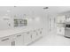 Bright kitchen features a large island, sleek black hardware, modern appliances, and a clean, contemporary design at 3552 Middletown St, Port Charlotte, FL 33952