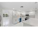 Open kitchen with modern white cabinetry, stainless appliances, and a spacious layout for cooking and entertaining at 3552 Middletown St, Port Charlotte, FL 33952