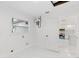 Laundry area showcasing updated marble-look tile and white color scheme at 3552 Middletown St, Port Charlotte, FL 33952