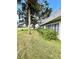 Lush lawn and mature trees create a serene backyard setting at 3725 Teeside Dr, New Port Richey, FL 34655