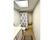 Compact bathroom featuring a vanity, toilet, and tub with a patterned shower curtain and earth-toned floor at 3725 Teeside Dr, New Port Richey, FL 34655