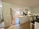 Open kitchen featuring white cabinetry, modern appliances, and seamlessly connects to dining at 3725 Teeside Dr, New Port Richey, FL 34655