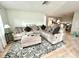 Cozy living room with a comfortable sectional sofa, stylish rug, and bright, airy feel at 3725 Teeside Dr, New Port Richey, FL 34655