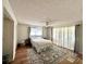Bright bedroom with laminate floors, ceiling fan, and lots of natural light at 3725 Teeside Dr, New Port Richey, FL 34655
