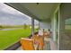 Relaxing screened porch overlooking a picturesque backyard with a pond at 3816 N Maryland Ave, Plant City, FL 33565