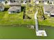 Aerial of a spacious backyard with a dock and direct water access at 3816 N Maryland Ave, Plant City, FL 33565