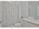 Clean bathroom featuring a shower with floral curtain and a white vanity at 3816 N Maryland Ave, Plant City, FL 33565