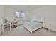 Serene bedroom with a large window, plush carpet, and neutral decor at 3816 N Maryland Ave, Plant City, FL 33565