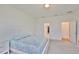 Bright bedroom with light walls, carpet flooring, and walk-in closet access at 3816 N Maryland Ave, Plant City, FL 33565