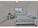 Light-filled bedroom complete with a bed, desk, and chair creating an ideal living and working space at 3816 N Maryland Ave, Plant City, FL 33565