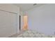 A bedroom view showing a closet and an open doorway to the hall with hardwood floors at 3816 N Maryland Ave, Plant City, FL 33565
