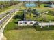 Aerial view of a landscaped community entrance with signage and greenery at 3816 N Maryland Ave, Plant City, FL 33565