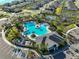 Overhead view of the community pool, clubhouse, and spacious parking area at 3816 N Maryland Ave, Plant City, FL 33565