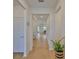 Inviting hallway with wood floors, fresh paint, and seamless flow at 3816 N Maryland Ave, Plant City, FL 33565
