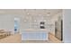 Gourmet kitchen with an island, stainless steel appliances, and white cabinets at 3816 N Maryland Ave, Plant City, FL 33565