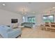 Inviting living room featuring stylish furniture, a modern entertainment center, and abundant natural light at 3816 N Maryland Ave, Plant City, FL 33565