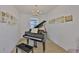 A room featuring a piano with artistic decor with natural lighting and a dark piano bench at 3816 N Maryland Ave, Plant City, FL 33565