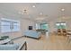 Bright and airy living room with large windows, comfortable seating, and neutral color palette at 3816 N Maryland Ave, Plant City, FL 33565
