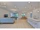 Open-concept living space with modern furnishings, light wood floors, and recessed lighting at 3816 N Maryland Ave, Plant City, FL 33565