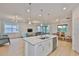 Expansive living space with an island, pendant lighting, and open concept design at 3816 N Maryland Ave, Plant City, FL 33565